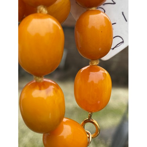 541 - Two string of butterscotch amber beads, approx length 80 & 52cm. 213.9gm.