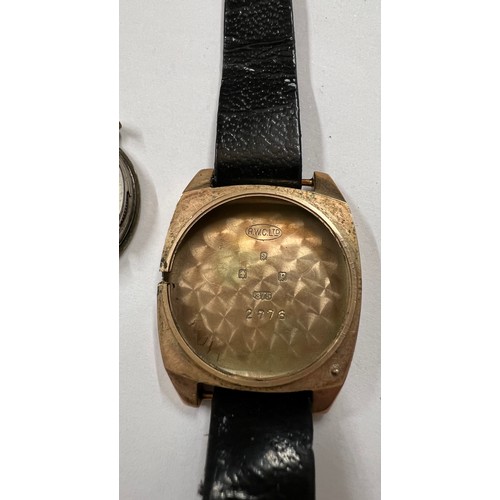 975 - A nine carat gold cased Rolex wristwatch on leather strap. 2.5cms square.