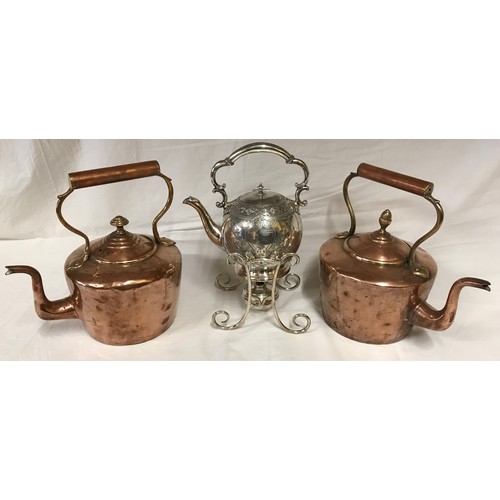 1051 - Two Victorian copper kettles and a silver plated spirit kettle. Copper kettles measuring at 29 h 28c... 