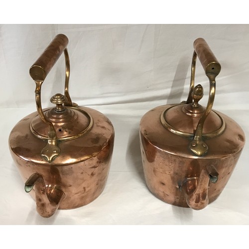 1051 - Two Victorian copper kettles and a silver plated spirit kettle. Copper kettles measuring at 29 h 28c... 