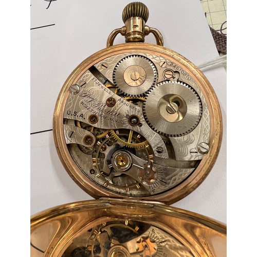 988 - A nine carat gold hunter pocket watch by Waltham. Keyless wind with white enamel dial with Roman num... 