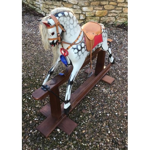 789A - Rocking horse on wooden base, dappled grey with tan leather seat, approx. 122cm long x 99cm high.