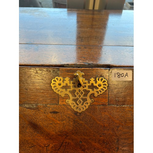 180A - A 18thC oak bureau on bracket feet with fitted interior and lidded compartment. 104 h x 59 d x 97cm ... 