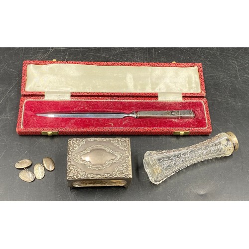 735 - A selection of silver to include a original boxed silver letter opener Sheffield 1973, a match box c... 