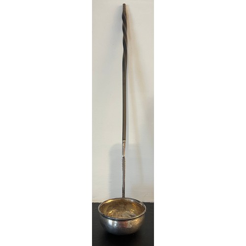 736 - A white metal and baleen toddy ladle, initialled to front. Length 32.5 cms.