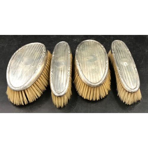 734 - Two pairs of identical men's grooming brushes with silver tops, Birmingham 1924 Williams Adams, 417g... 