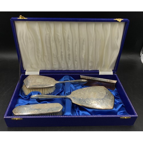 732 - Silver backed dressing table set to include mirror, hair/clothes brush and comb, Birmingham 1970's m... 