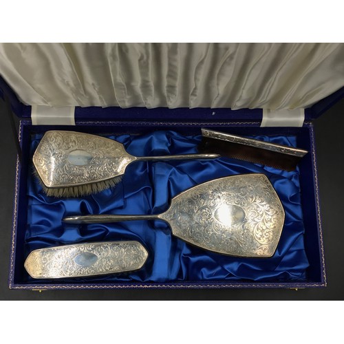 732 - Silver backed dressing table set to include mirror, hair/clothes brush and comb, Birmingham 1970's m... 