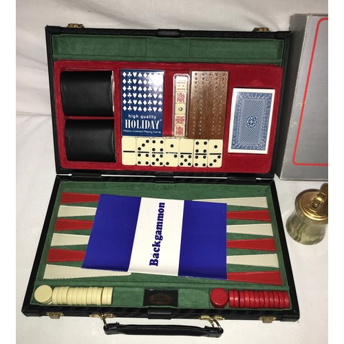 1099 - A leather case containing a backgammon game, along with an onyx table lighter and a boxed set of a c... 