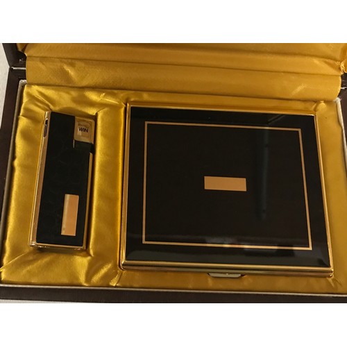 1099 - A leather case containing a backgammon game, along with an onyx table lighter and a boxed set of a c... 