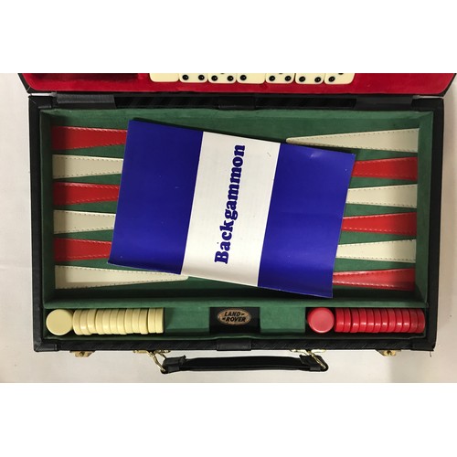 1099 - A leather case containing a backgammon game, along with an onyx table lighter and a boxed set of a c... 