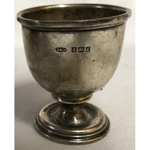 738 - A silver egg cup dated 1960 by W I Broadway & Co, a glass flask with silver top and silver removeabl... 