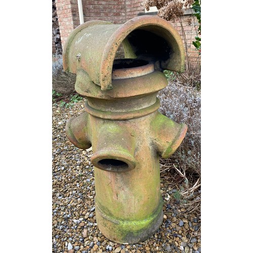 97 - A terracotta chimney pot 92cm h x 42cm w.