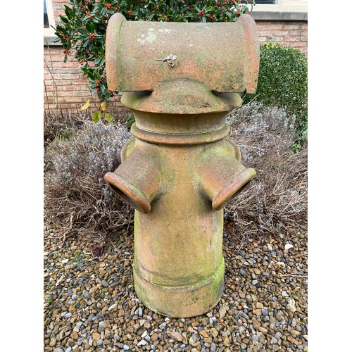 97 - A terracotta chimney pot 92cm h x 42cm w.