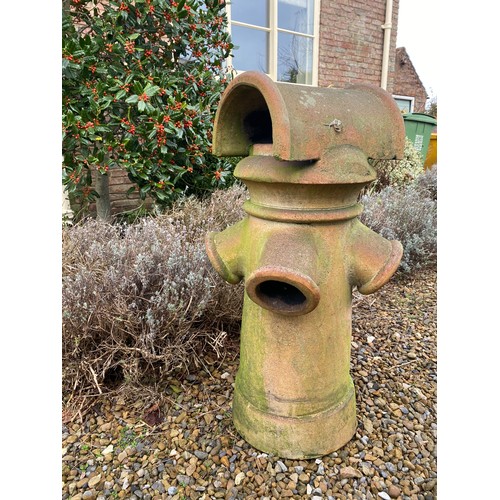 97 - A terracotta chimney pot 92cm h x 42cm w.