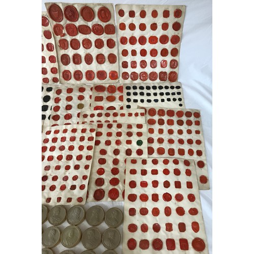 1106 - A large collection of 19thC Grand Tour Red Wax Intaglios along with 23 plaster impressions of coins.