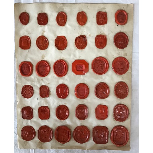 1106 - A large collection of 19thC Grand Tour Red Wax Intaglios along with 23 plaster impressions of coins.