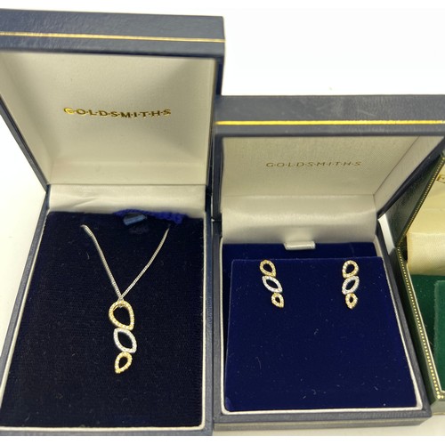 432 - Goldsmiths 18 carat gold and diamond pendant and matching earrings in original boxes together with 9... 