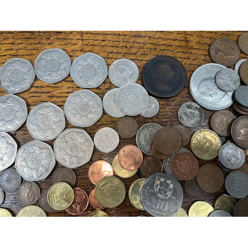 784 - A collection of coins to include mainly 1973 50p's, sixpences, Francs, Cents, etc.