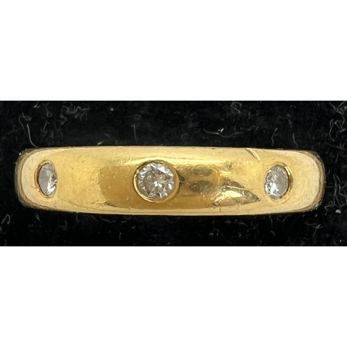 411 - An 18 carat diamond set gold wedding band. Weight 4.9gm. Size P. Marked 750.