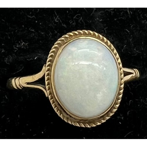 414 - A nine carat gold ring set with opal. Total weight 1.7gm. Size O.