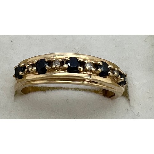 416 - A nine carat gold gem set ring. Weight 2.2gm. Size P.