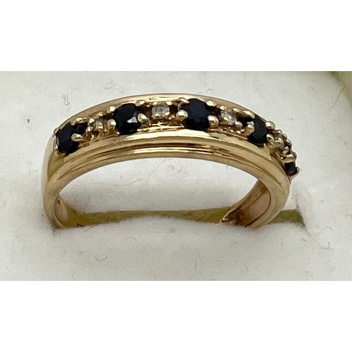 416 - A nine carat gold gem set ring. Weight 2.2gm. Size P.