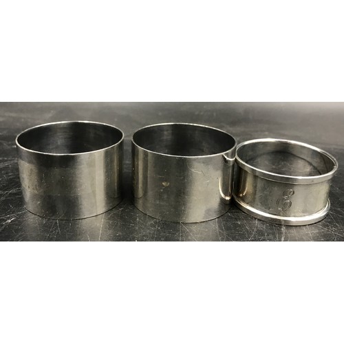 688 - Three hallmarked Birmingham silver napkin rings to include 2 x 1944 E.J Houlston and  a 1933 Henry G... 