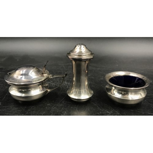 723 - A silver cruet set two with blue glass liners two marked Birmingham 1918 the other Birmingham 1919. ... 