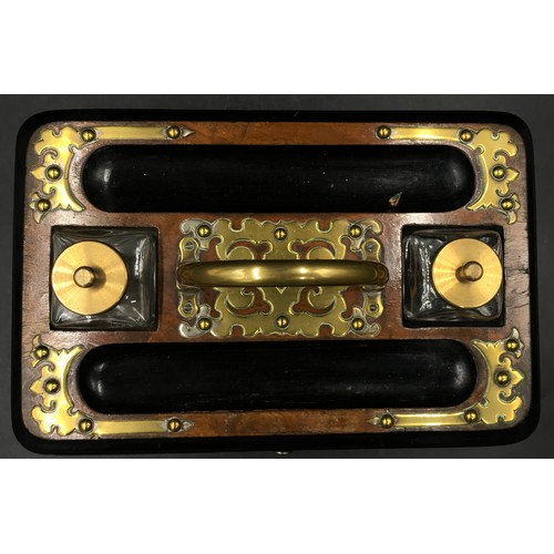 1089 - A rectangular wooden ink stand with two detachable glass inkwells, central brass carrying handle and... 