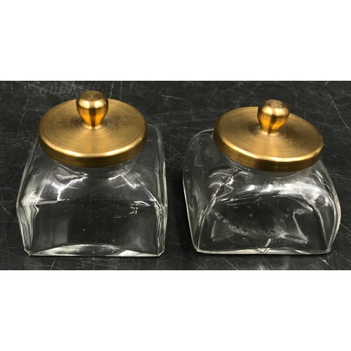 1089 - A rectangular wooden ink stand with two detachable glass inkwells, central brass carrying handle and... 