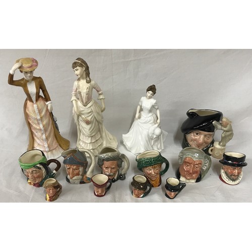 246 - A collection of 11 toby jugs of various size largest Tam o'Shanter along with three figurines, two o... 