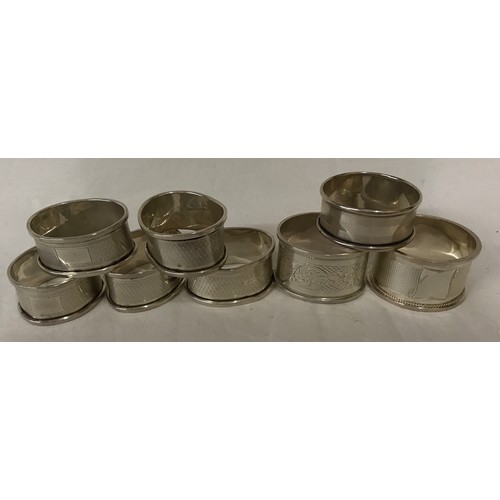 726 - Eight silver napkin rings total weight 100gms Birmingham 1932, 5 matching and 3 individual.