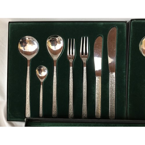 676 - Gerald Benney for Viners, 58 pieces of stainless steel table cutlery for eight persons with Bark pat... 