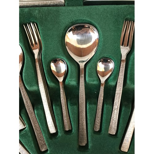 676 - Gerald Benney for Viners, 58 pieces of stainless steel table cutlery for eight persons with Bark pat... 