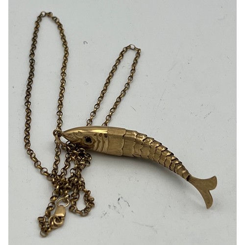 429 - Nine carat gold reticulated fish on 9 carat gold chain. Total weight 6gm. Chain 60cm long. Fish 6cm ... 