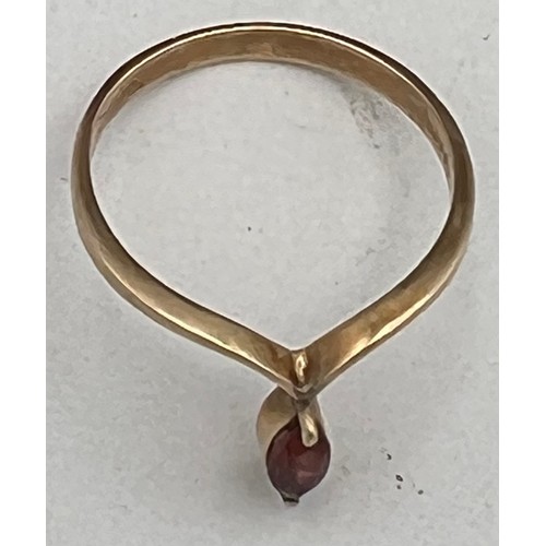 430 - A 9 carat gold ring set with garnet. Size N.