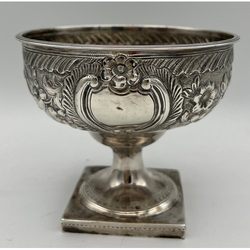 739 - A silver pedestal bowl Dublin 1791, maker's mark I.I (unknown) with foliate repoussé decoration and ... 