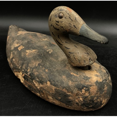 1092 - An early 20thC decoy duck along with an antique brass two tone railway signal horn.