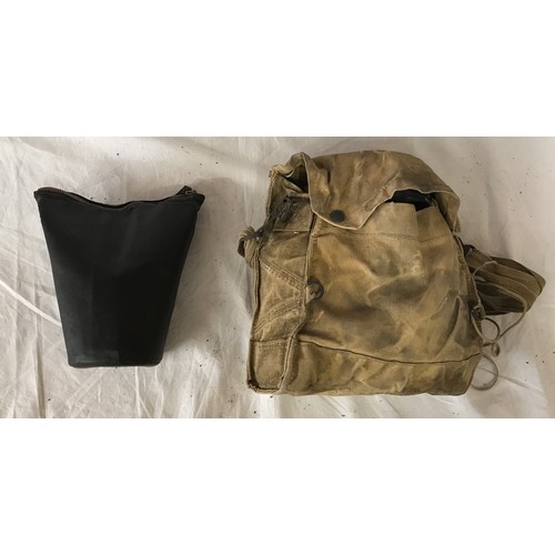 1094 - Two vintage gas masks both with fitted bags one with a Military operations in the desert booklet.