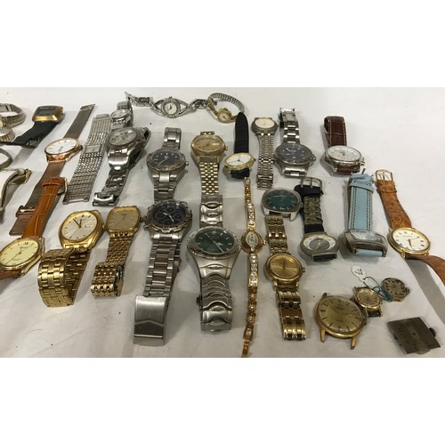 672 - A large collection of watches to include some by Quartz, Sekonda and Rotary.