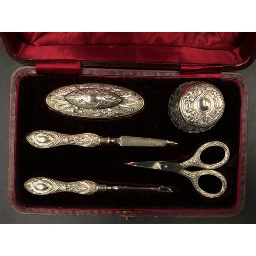 741 - A hallmarked silver mounted five piece vanity set with Art Nouveau and iris decoration, Birmingham 1... 