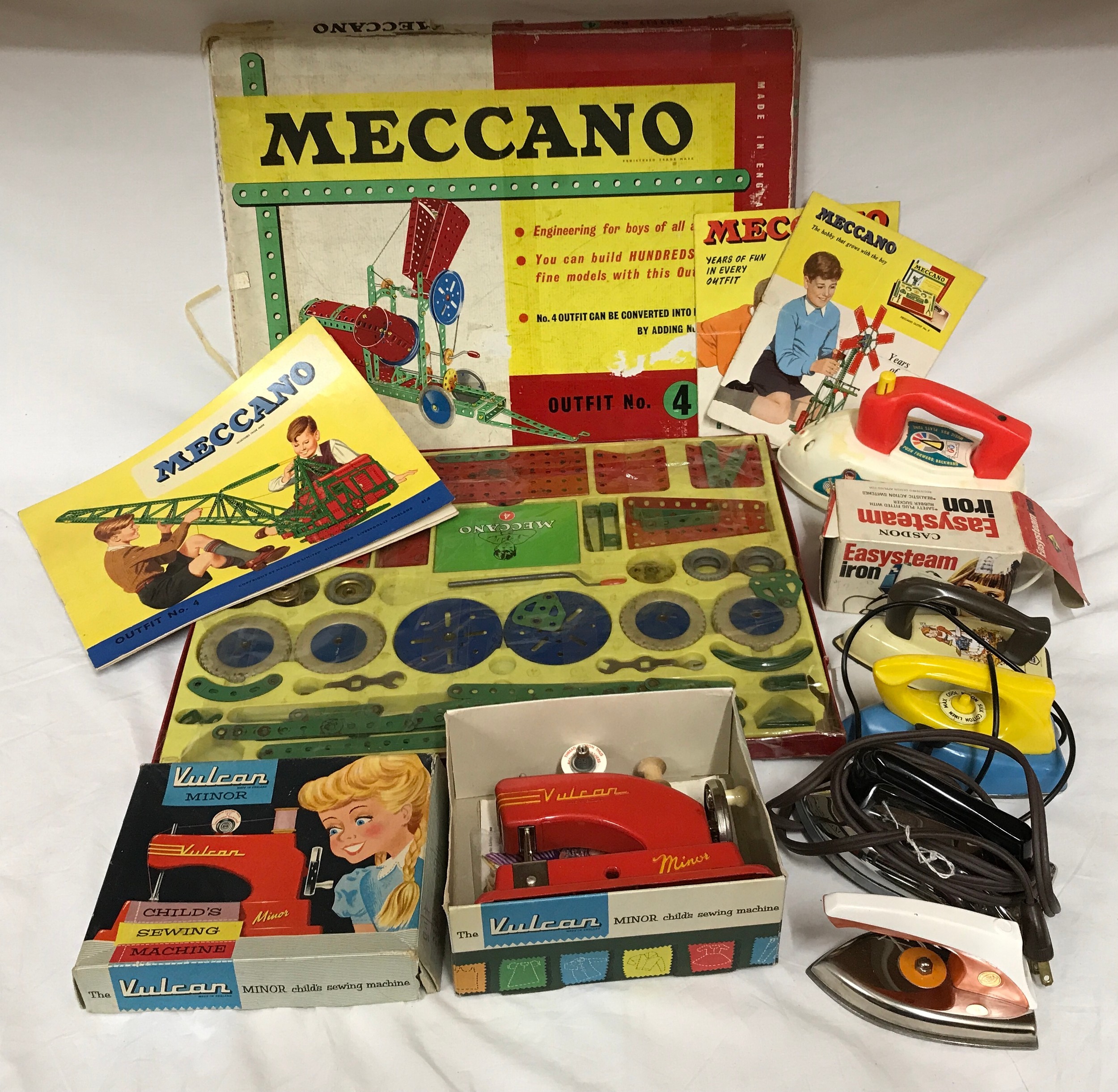 A selection of vintage toys to include Meccano Outfit No 4, Vulcan Minor  Child's sewing machine and