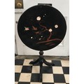 A lacquered chinoiserie decorated, circular tip top pedestal table. 54 d x 64cm h.