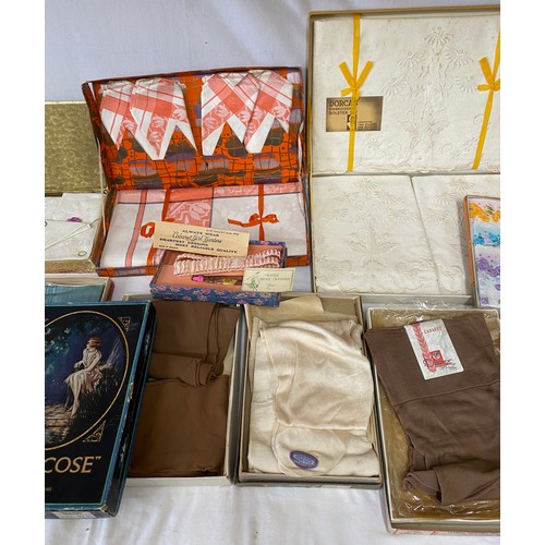 1077 - A quantity of boxed vintage items to include silk stockings, London holeproof Countess Pure Silk Hos... 