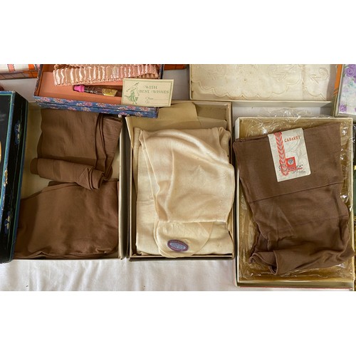 1077 - A quantity of boxed vintage items to include silk stockings, London holeproof Countess Pure Silk Hos... 