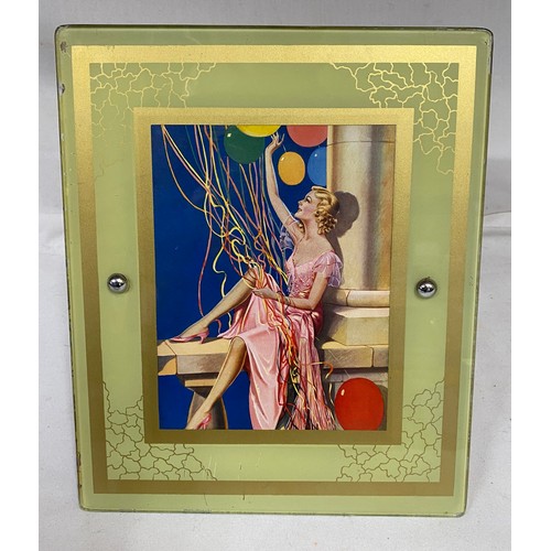 1118 - Glass covered print of a lady with balloons total size 31cm x 25cm, wooden back with stand.