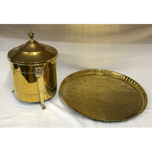 817 - A large brass table top with Egyptian style decoration measuring 61cm in diameter along with a brass... 