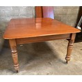 A Victorian mahogany pull out dining table with turned legs and two extra leaves. On castors. 73 h x... 