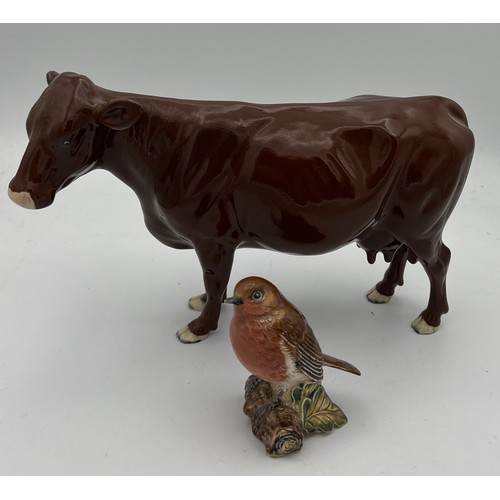 231 - Beswick brown cow 24cm long, Beswick Robin and a Royal Worcester First Dance modelled by F.G.Doughty... 